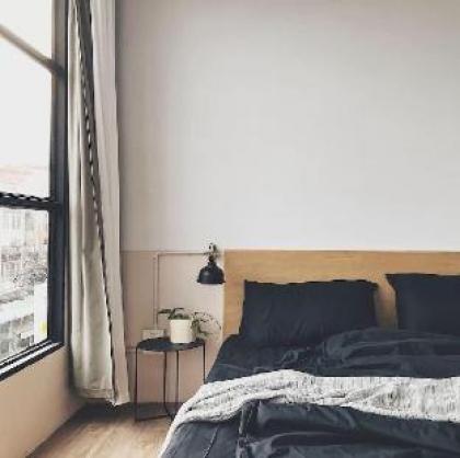 Beige Poshtels Grayscale room near DMK