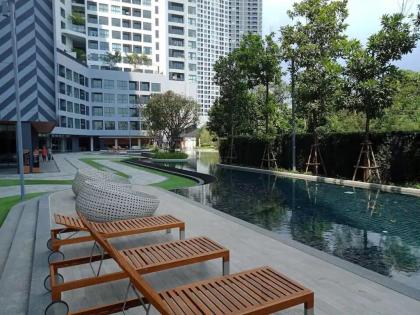 Resort style condo high floor studio pool view - image 21