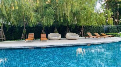 Resort style condo high floor studio pool view - image 22